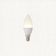 Cool white LED candle light bulb on a white background