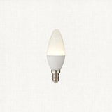 Cool white LED candle light bulb on a white background