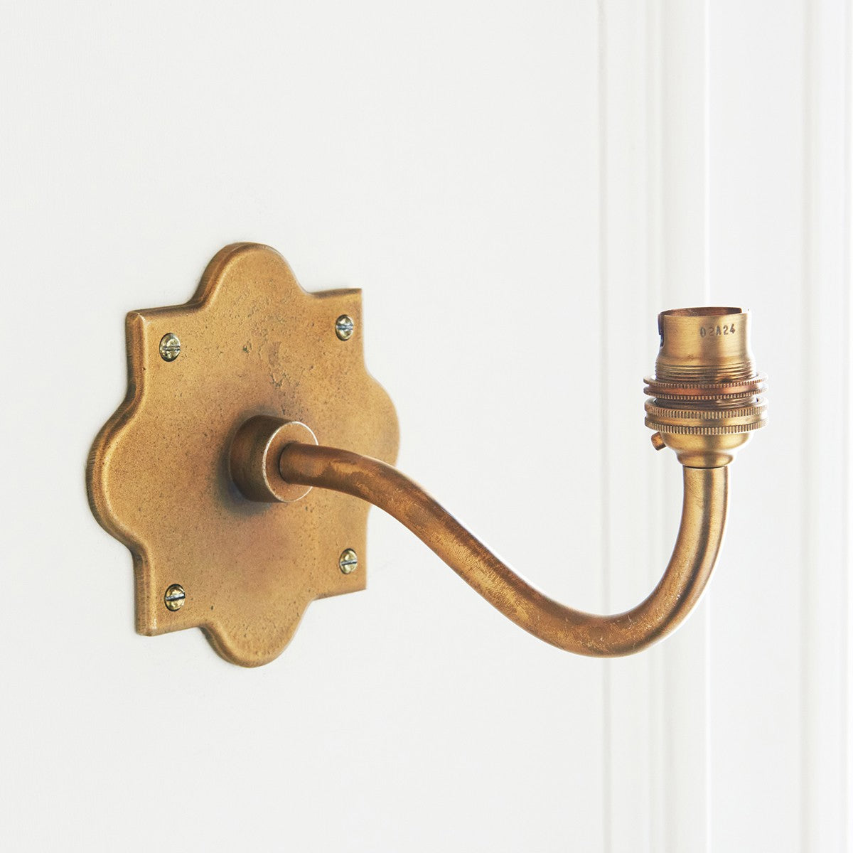 Rivet Curva Antique Brass Wall Light with Artisan Sand Casting