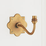 Rivet Curva Antique Brass Wall Light with Artisan Sand Casting