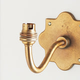Rivet Curva Antique Brass Wall Light with Artisan Sand Casting