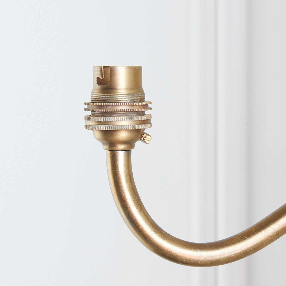Dalara Curva Sconce Wall Lighting Fixture in Antique Brass with Artisan Sand Casting