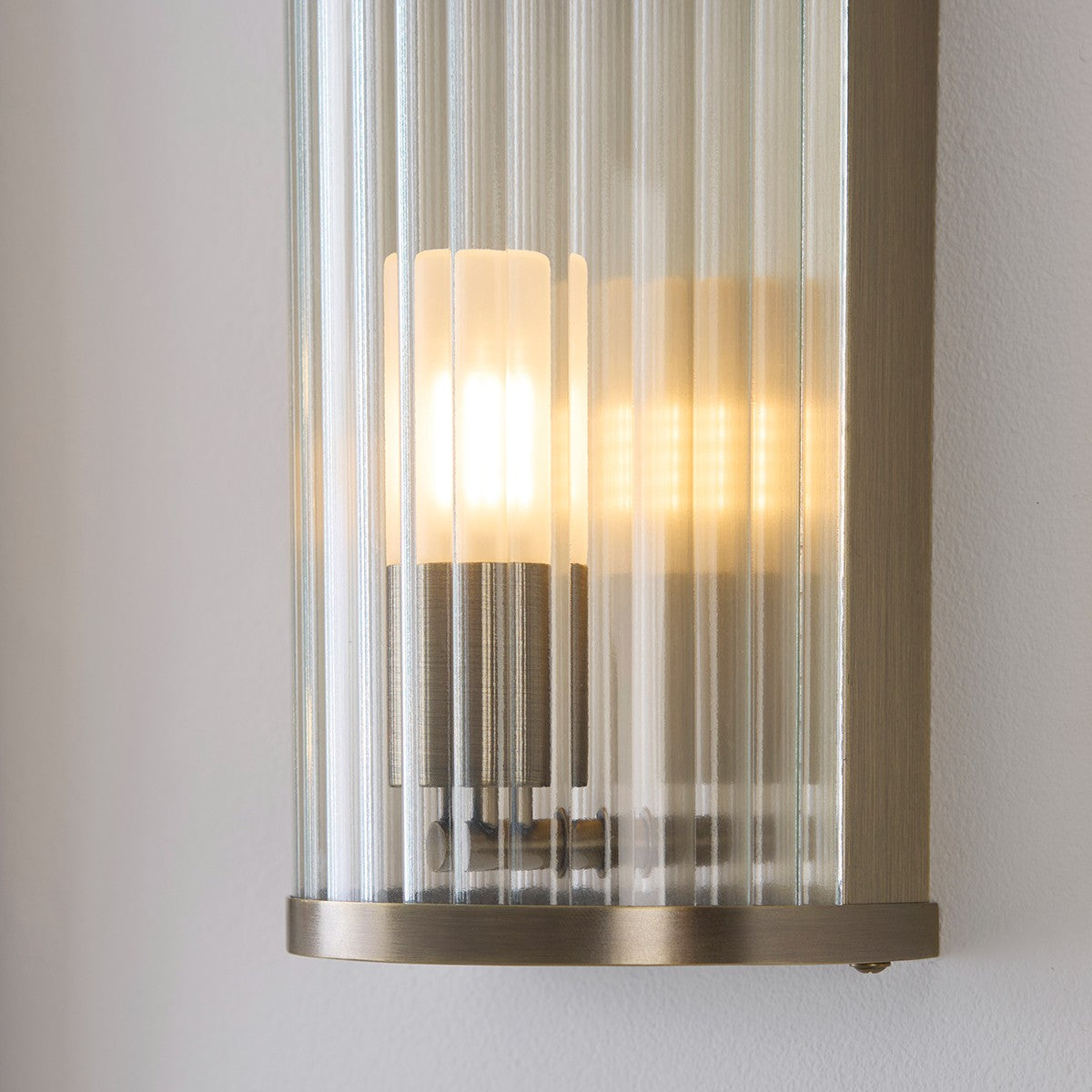 Radley Bathroom Wall Light in Antique Brass with Ribbed Glass