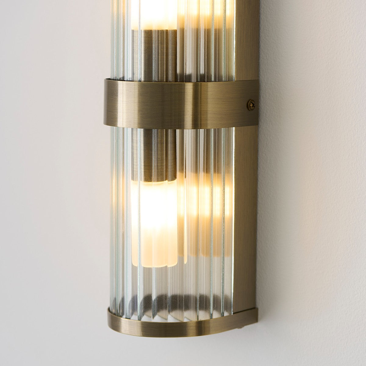 Radley Twin Bathroom Wall Light in Antique Brass with Ribbed Glass