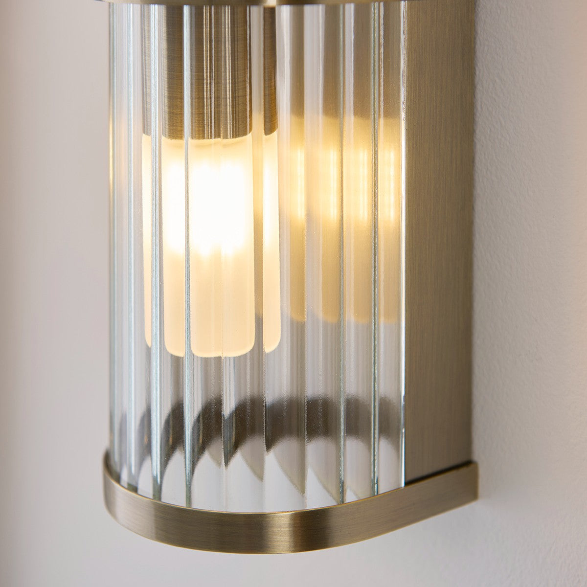 Radley Twin Bathroom Wall Light in Antique Brass with Ribbed Glass