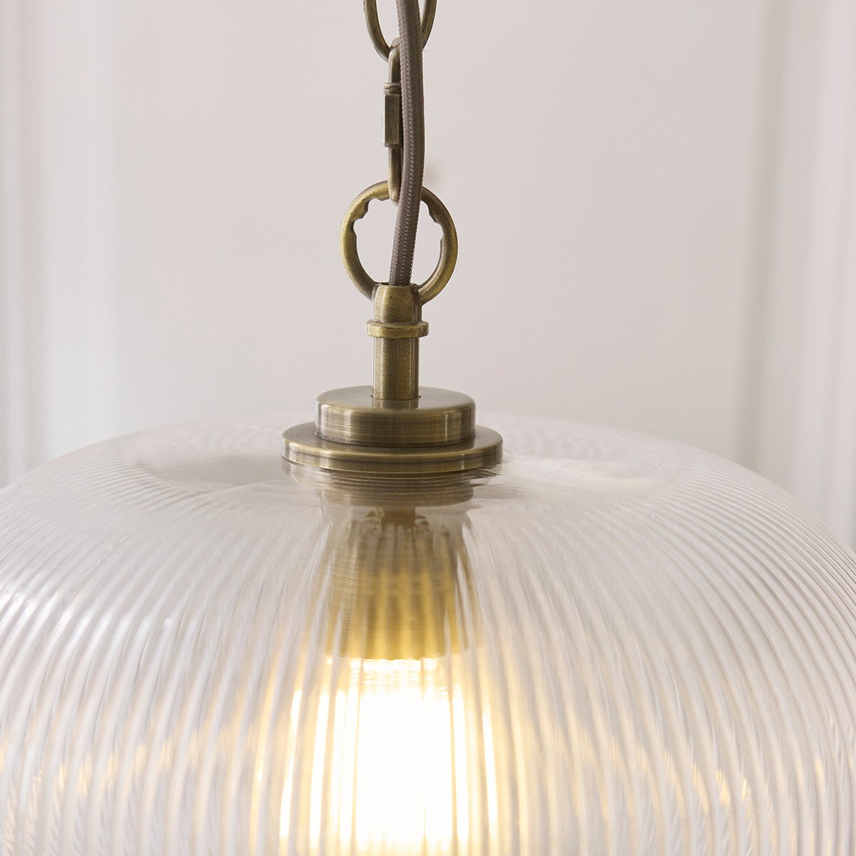 Harmont Ribbed Glass Globe Pendant Light in Antique Brass