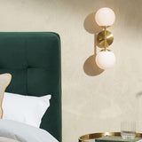 MADE Globe Mid Century Wall Light in Brushed Brass with Opal Glass Shades