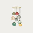 MADE Ilaria 8 Light Large Ceiling Light with Green Glass Lamp Shades and Polished Brass Details