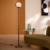 MADE Layla Wood Floor Light in Antique Brass with Opal Glass Lamp Shade