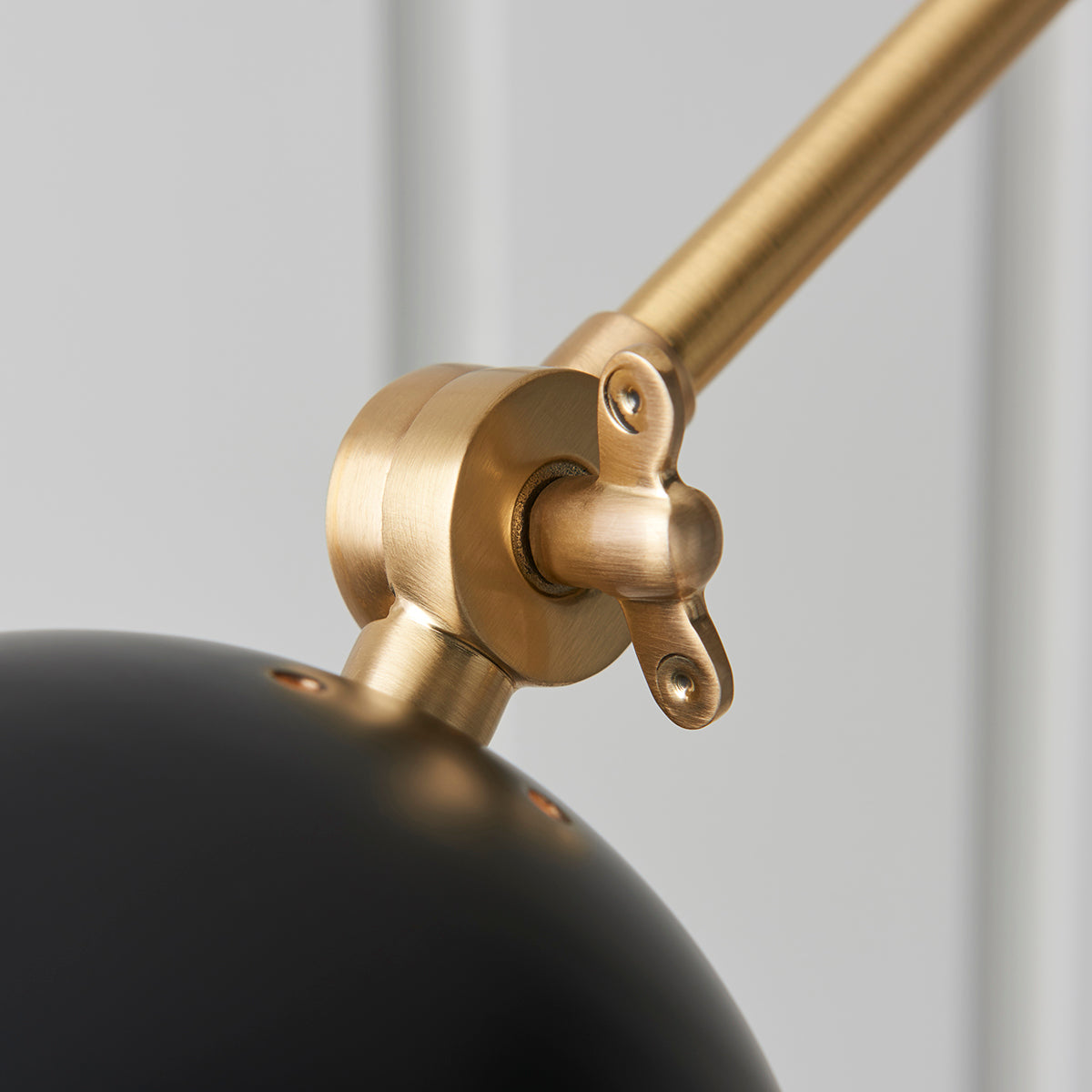 Lila Wall Light in Antique Brass and Matt Black
