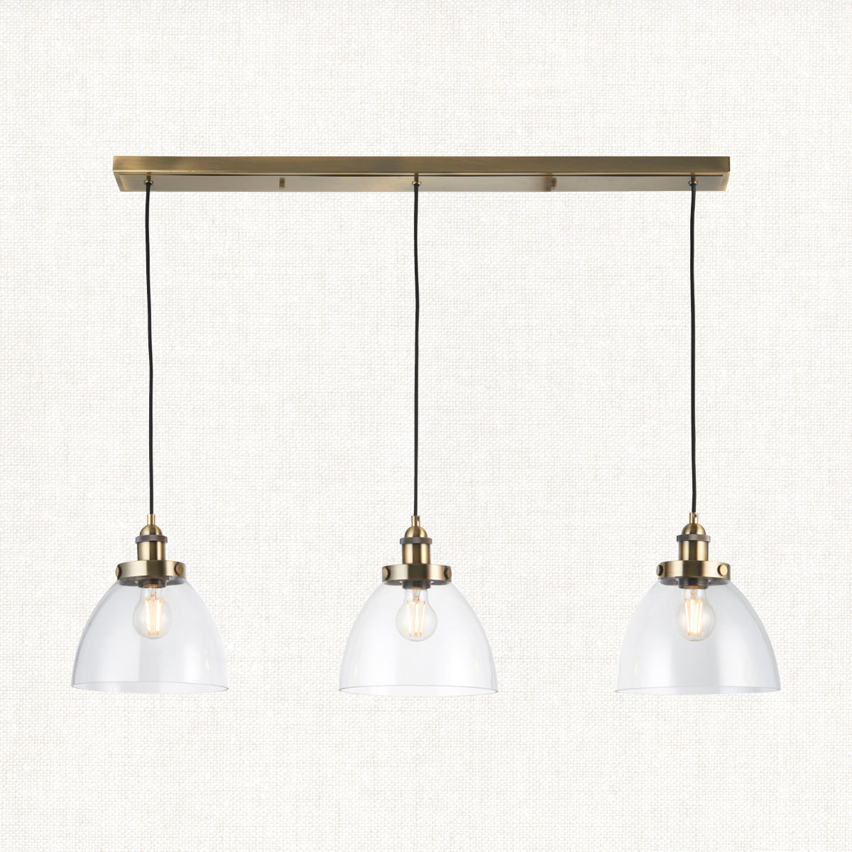 Marlowe Clear Glass Three Light Pendant in Antique Brass