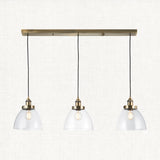 Marlowe Clear Glass Three Light Pendant in Antique Brass
