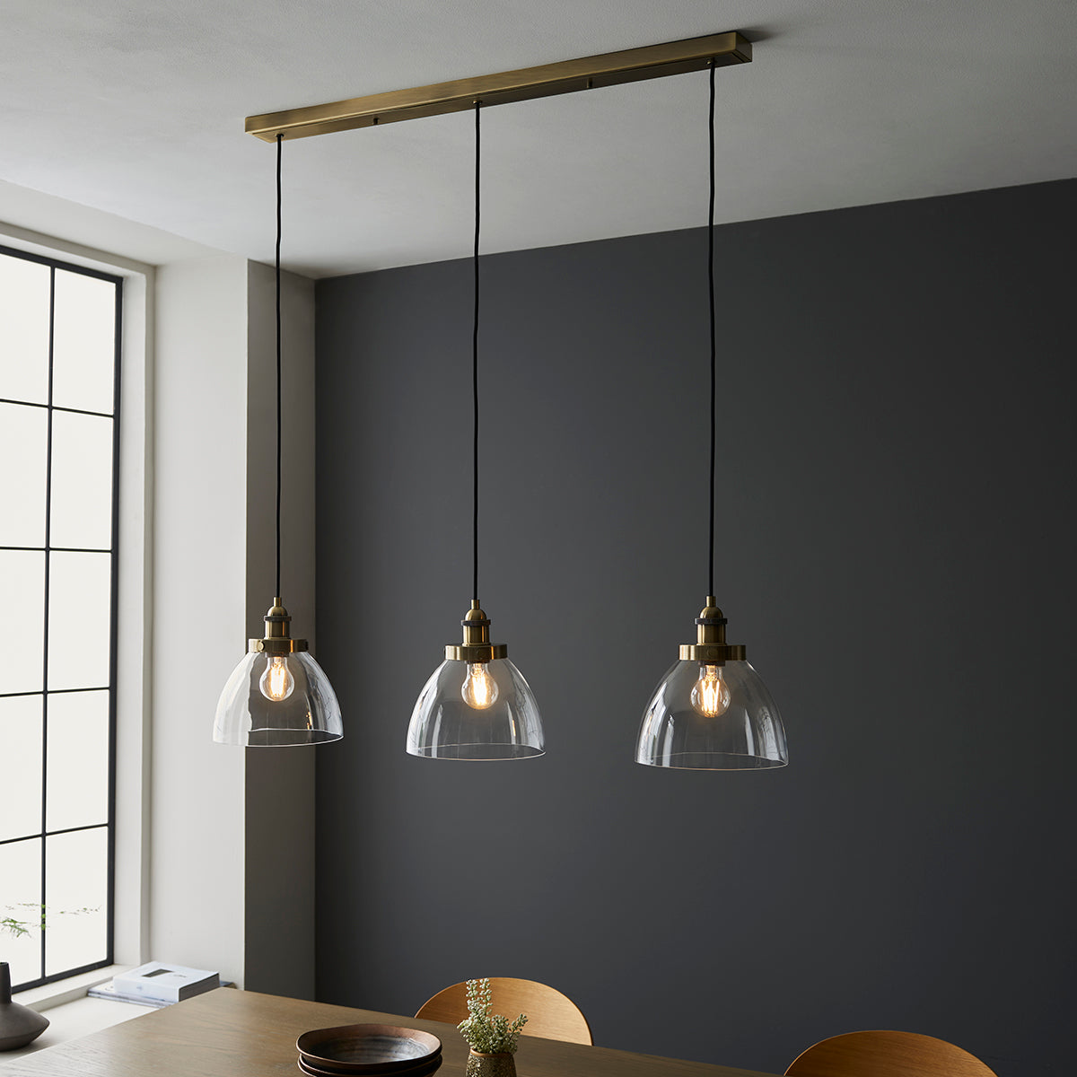 Marlowe Clear Glass Three Light Pendant in Antique Brass