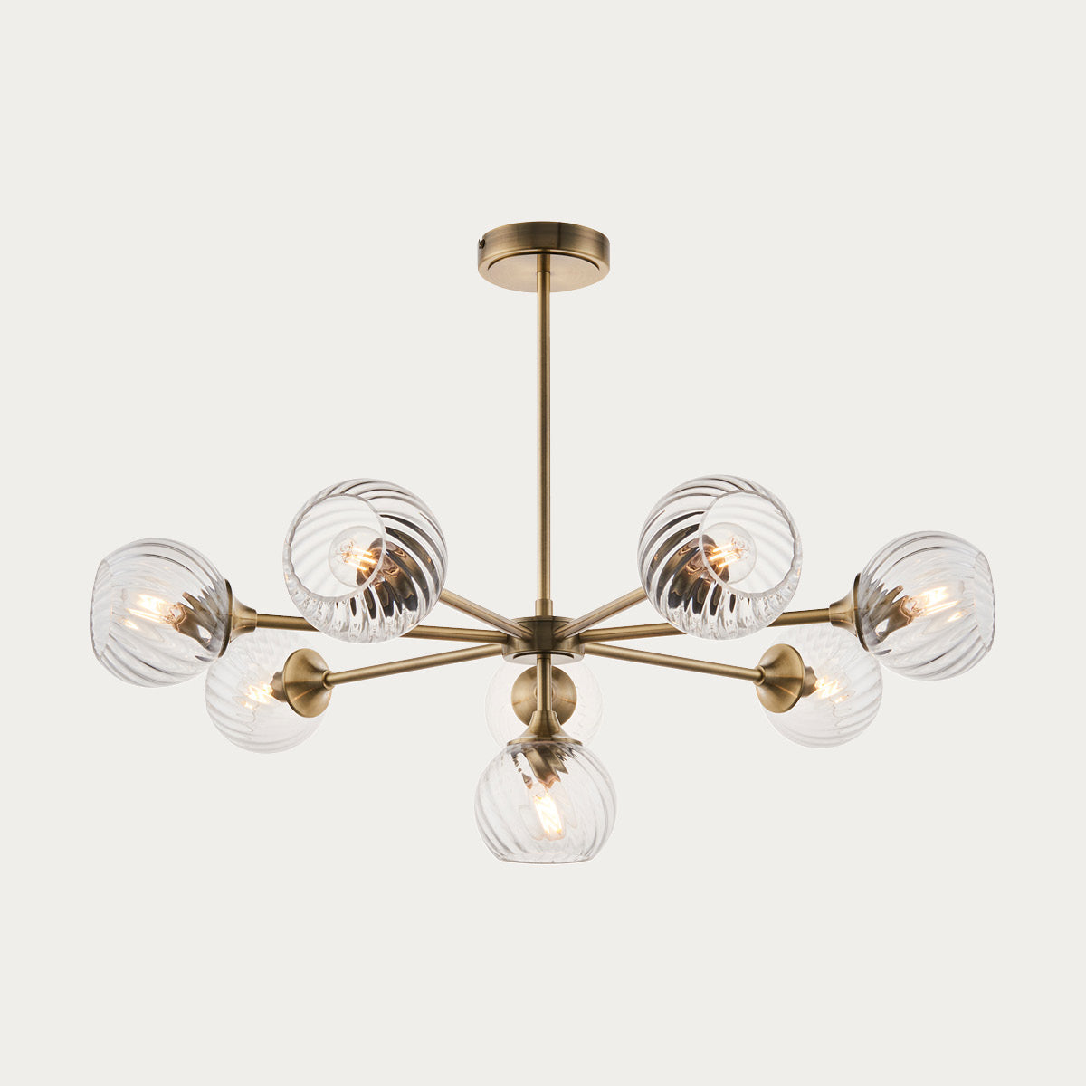 Madeline Spiral Glass Eight Light Pendant in Antique Brass