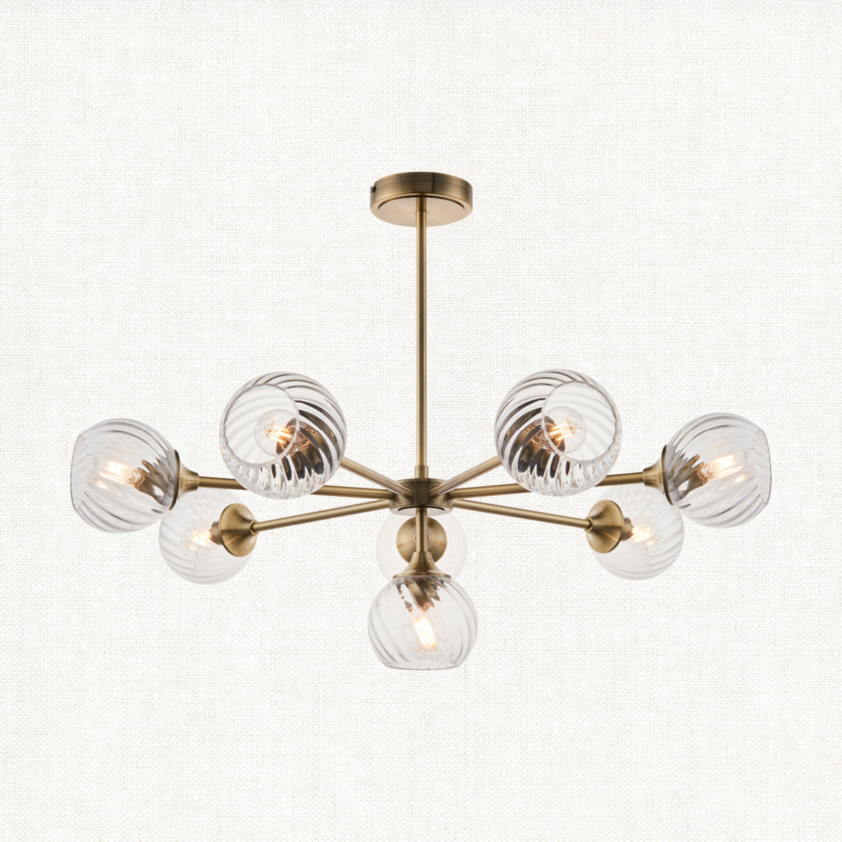 Madeline Spiral Glass Eight Light Pendant in Antique Brass
