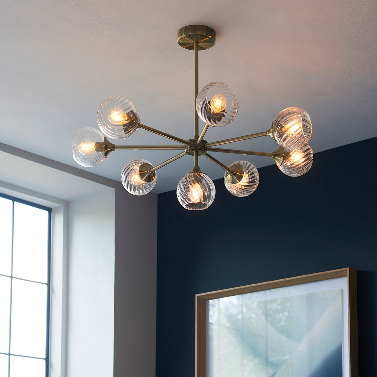 Madeline Spiral Glass Eight Light Pendant in Antique Brass