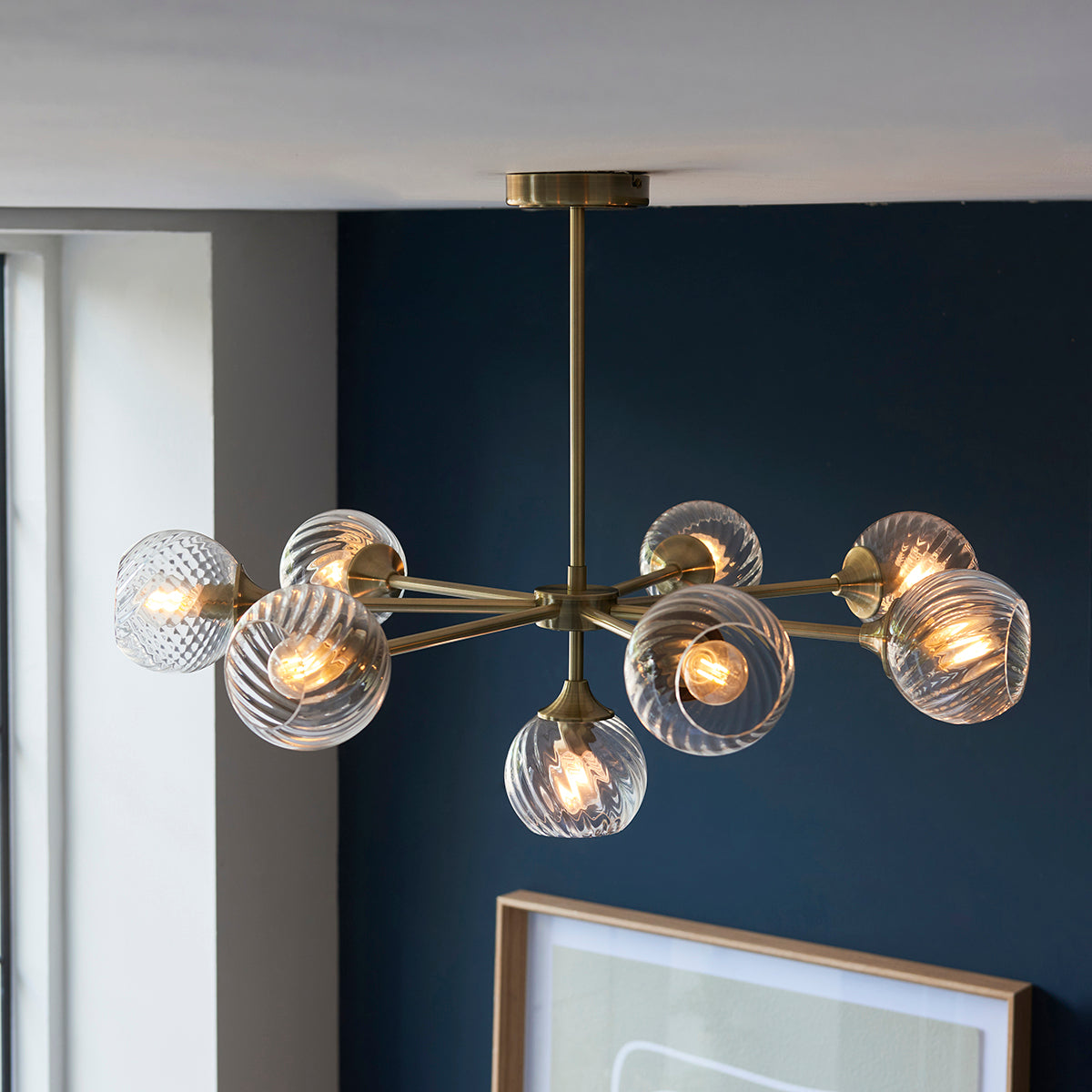 Madeline Spiral Glass Eight Light Pendant in Antique Brass