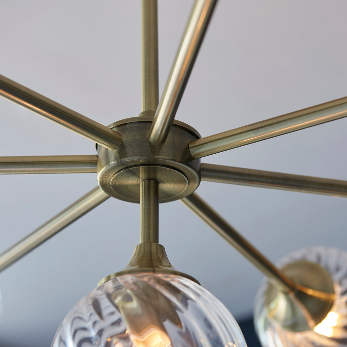 Madeline Spiral Glass Eight Light Pendant in Antique Brass