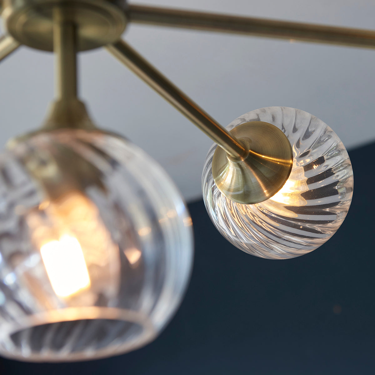 Madeline Spiral Glass Eight Light Pendant in Antique Brass