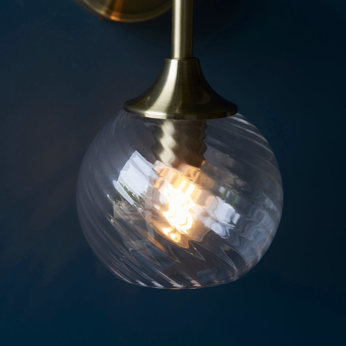 Madeline Spiral Glass Wall Light in Antique Brass