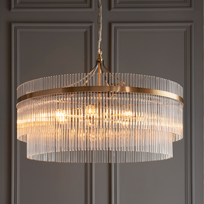 Grand pendant with warm brass detailing and crystal glass drops.