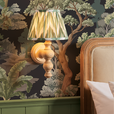 Stylish wall light with wooden base and arm, topped with a green zigzag pattern shade.